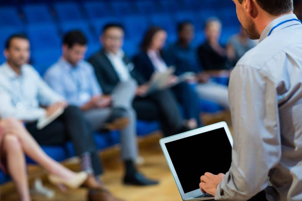 business executives participating in a business meeting at conference center